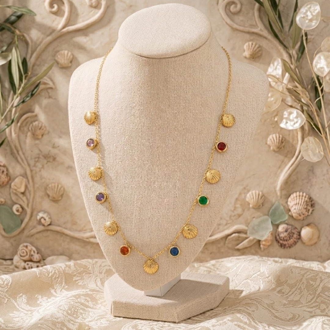 Luxury Gold Seashell Charm Necklace with Multicolor Gemstones – Elegant Beach-Inspired Statement Jewelry